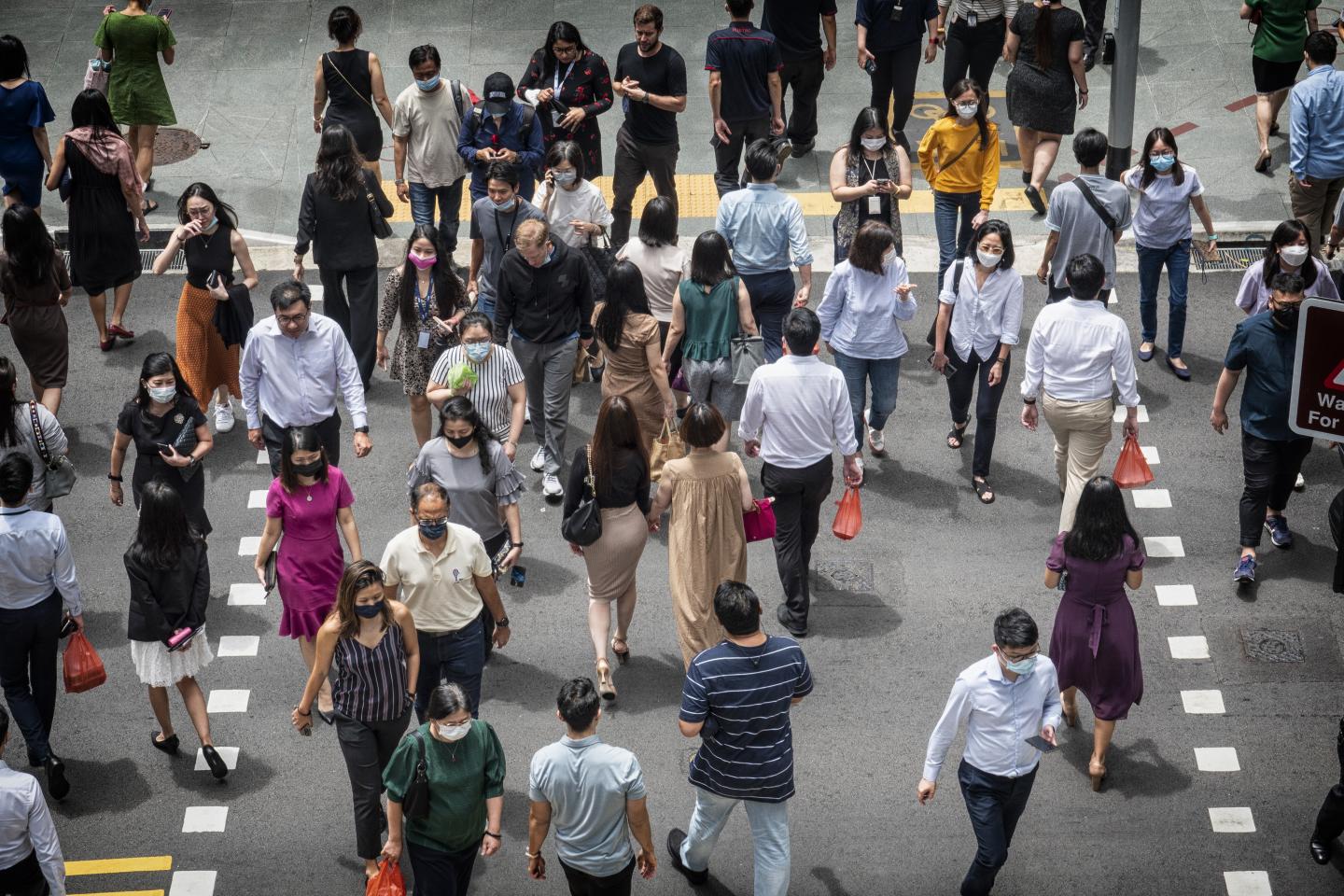 Singaporeans crossing the street