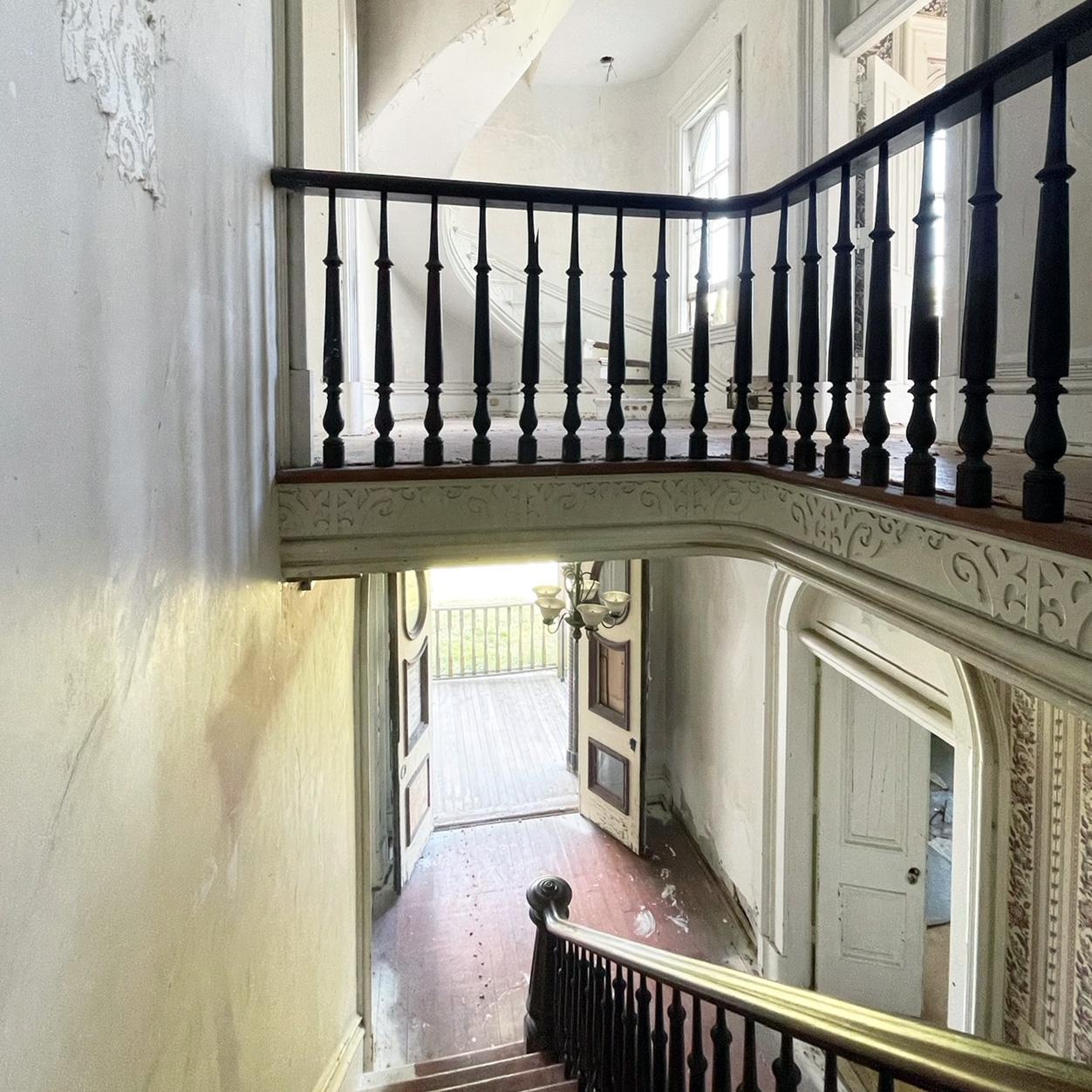 A view from the staircase into the foyer.