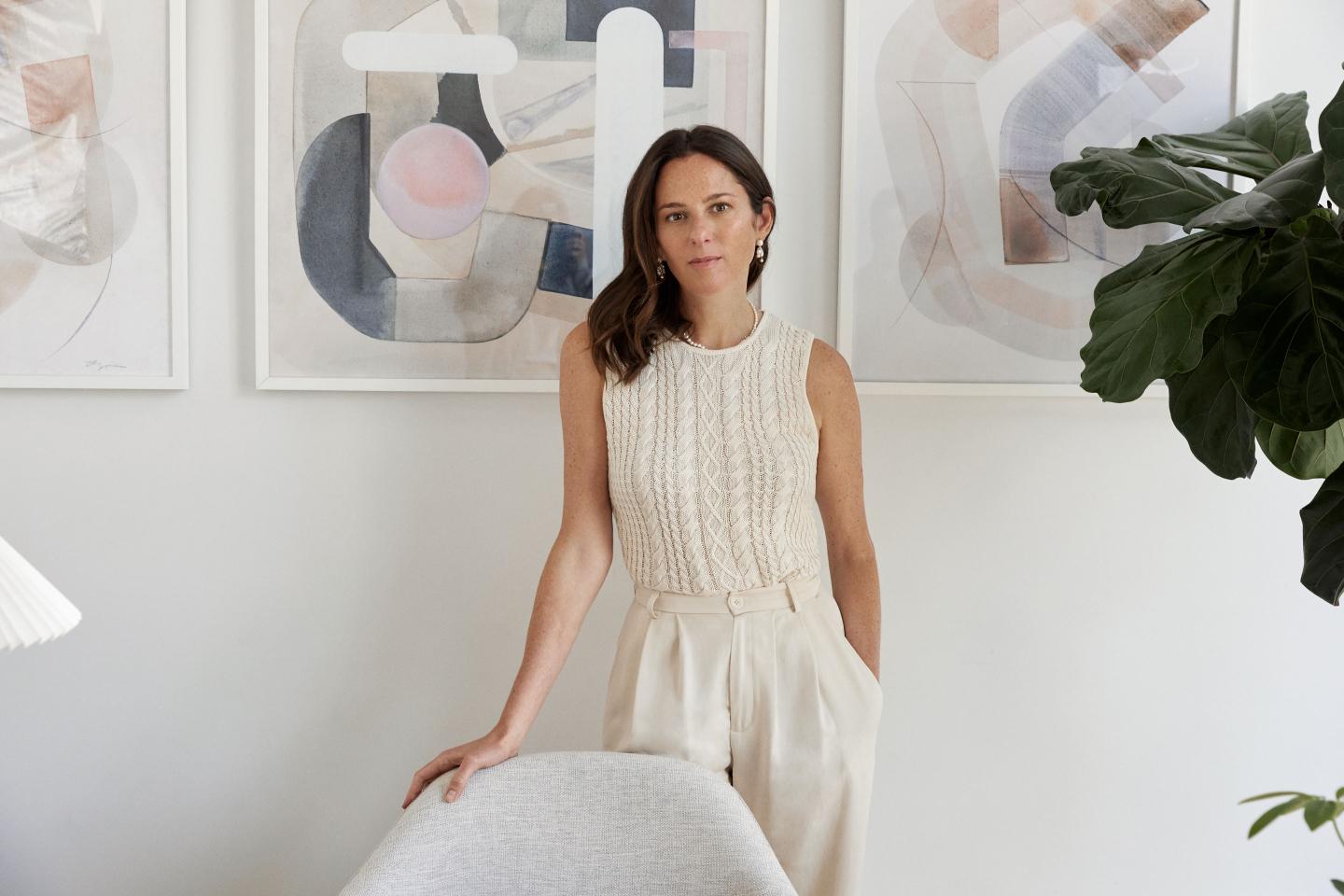 Reformation CEO Hali Borenstein standing behind a chair.