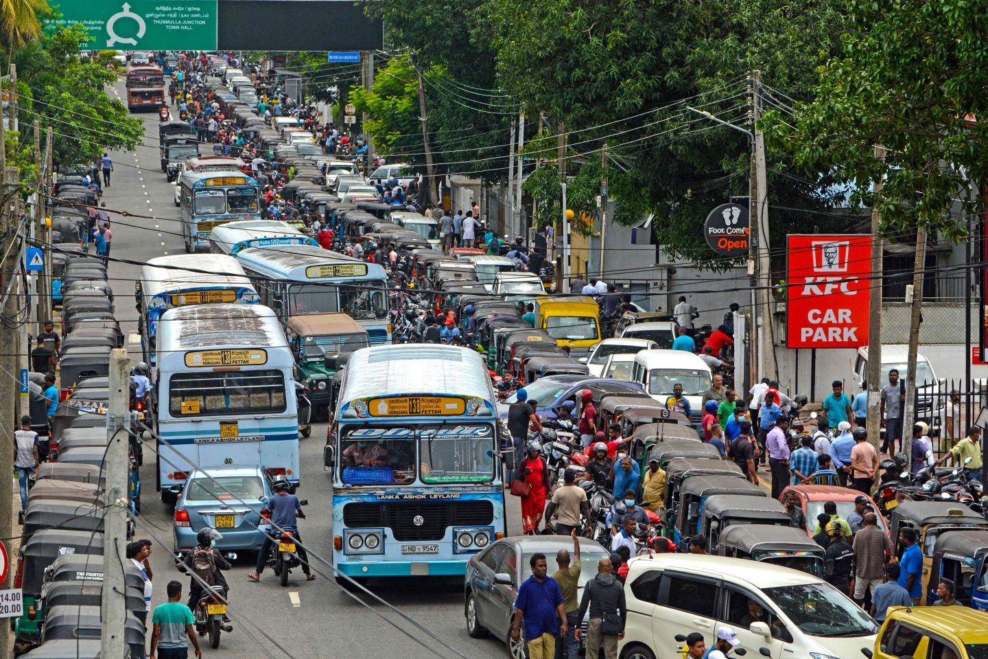 Motorists queue on the street to buy fuel from a fuel station in Colombo, Sri Lanka, on July 7, 2022.
