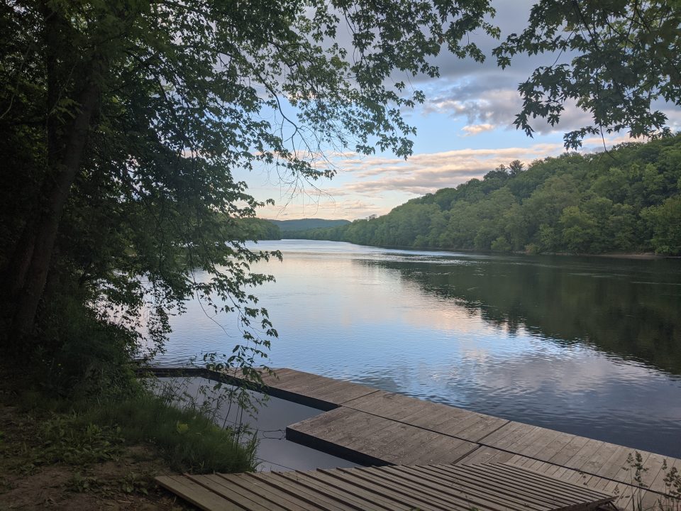 River side scene with trees and dock.