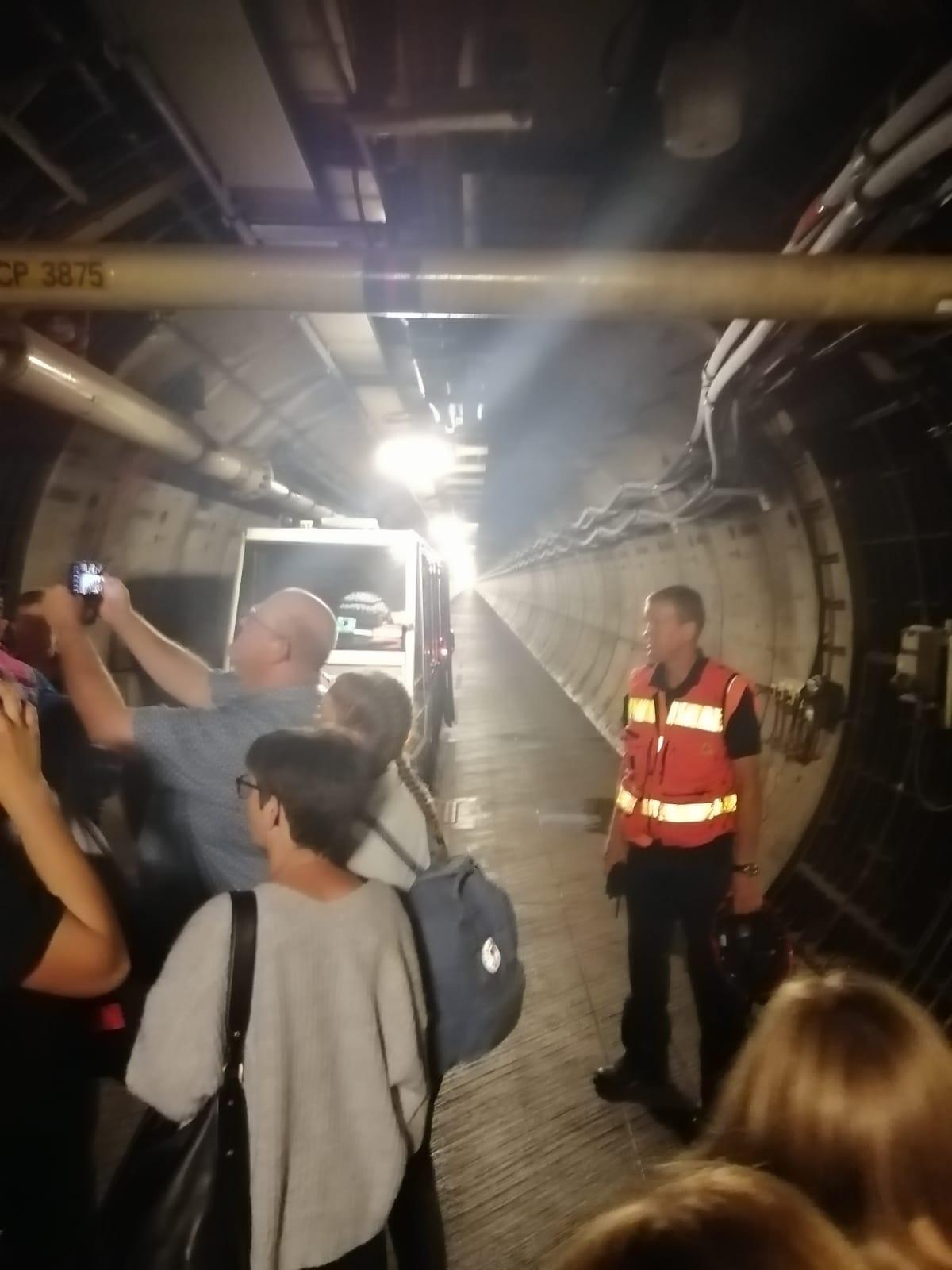 Passengers walking through the Eurotunnel service tunnel after being stranded.