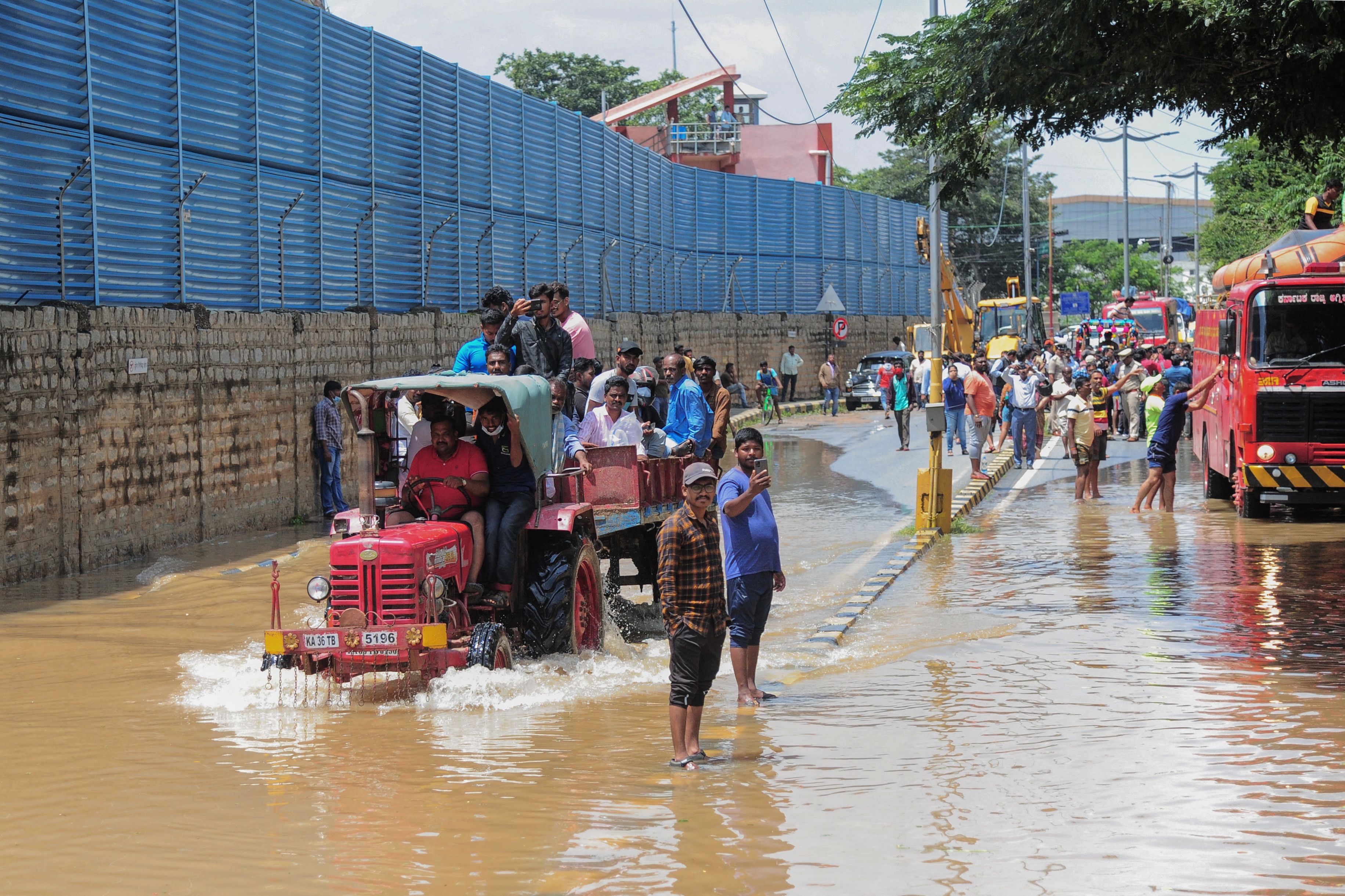 CEOs in India’s Silicon Valley Bangalore trip tractors to work in torrential rains 1