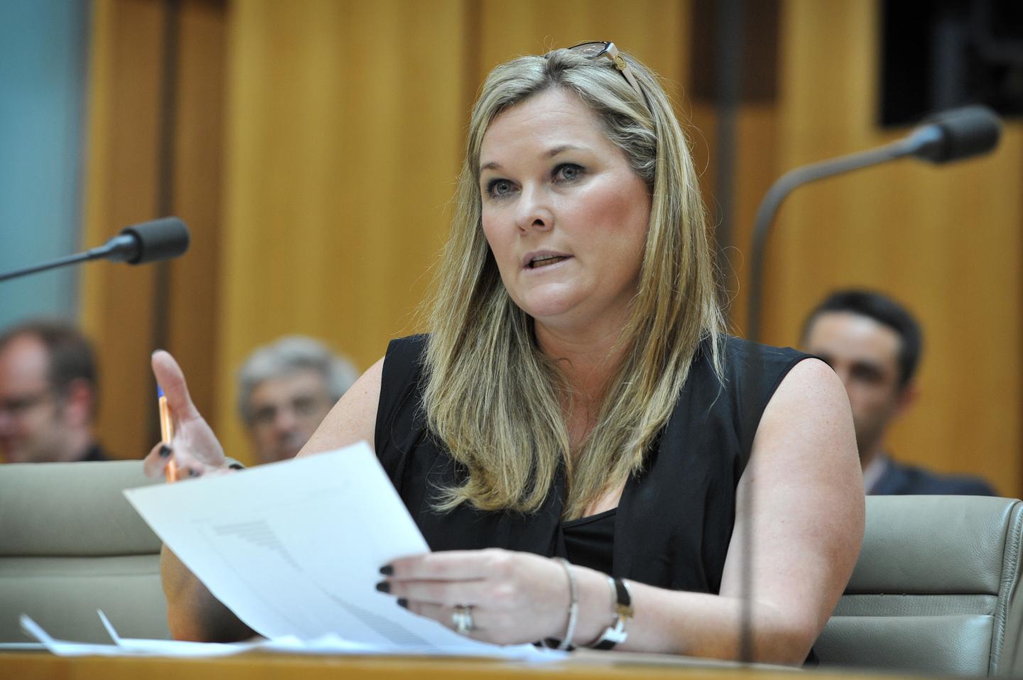 Pip Marlow, CEO of Salesforce Australia and New Zealand, holding a paper in hand as she speaks.