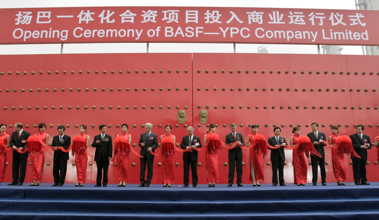 Chinese and German government officials and executives from BASF AG and Sinopec cut the ribbon Wednesday, September 28, 2005 to officially open their new joint venture facility outside of Nanjing, China.