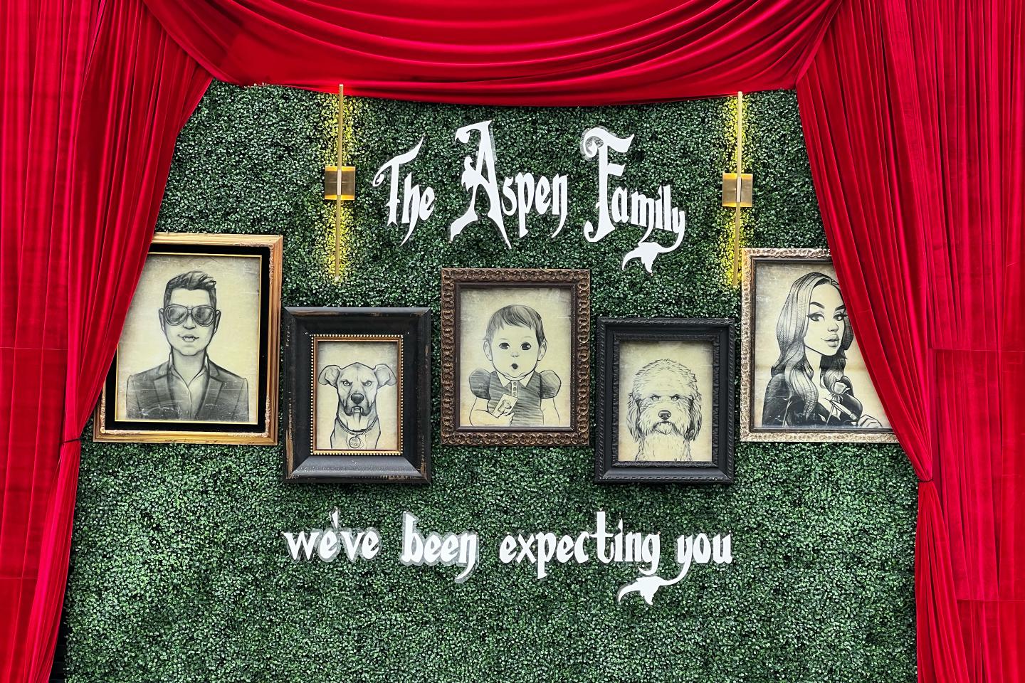 Cartoon portraits of a family behind velvet curtains.