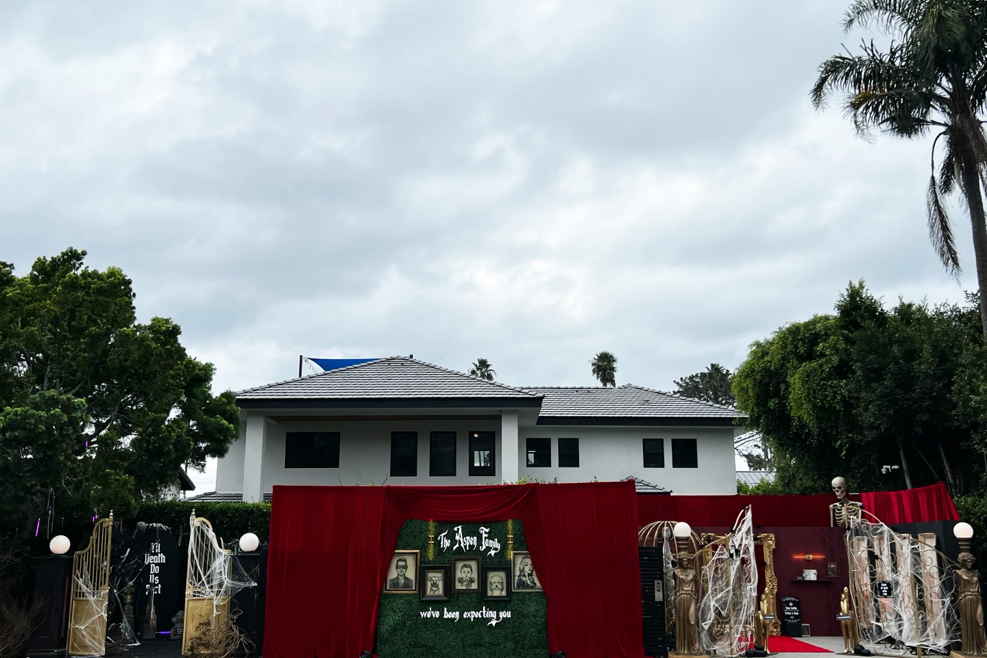 A Halloween display in front of a house.