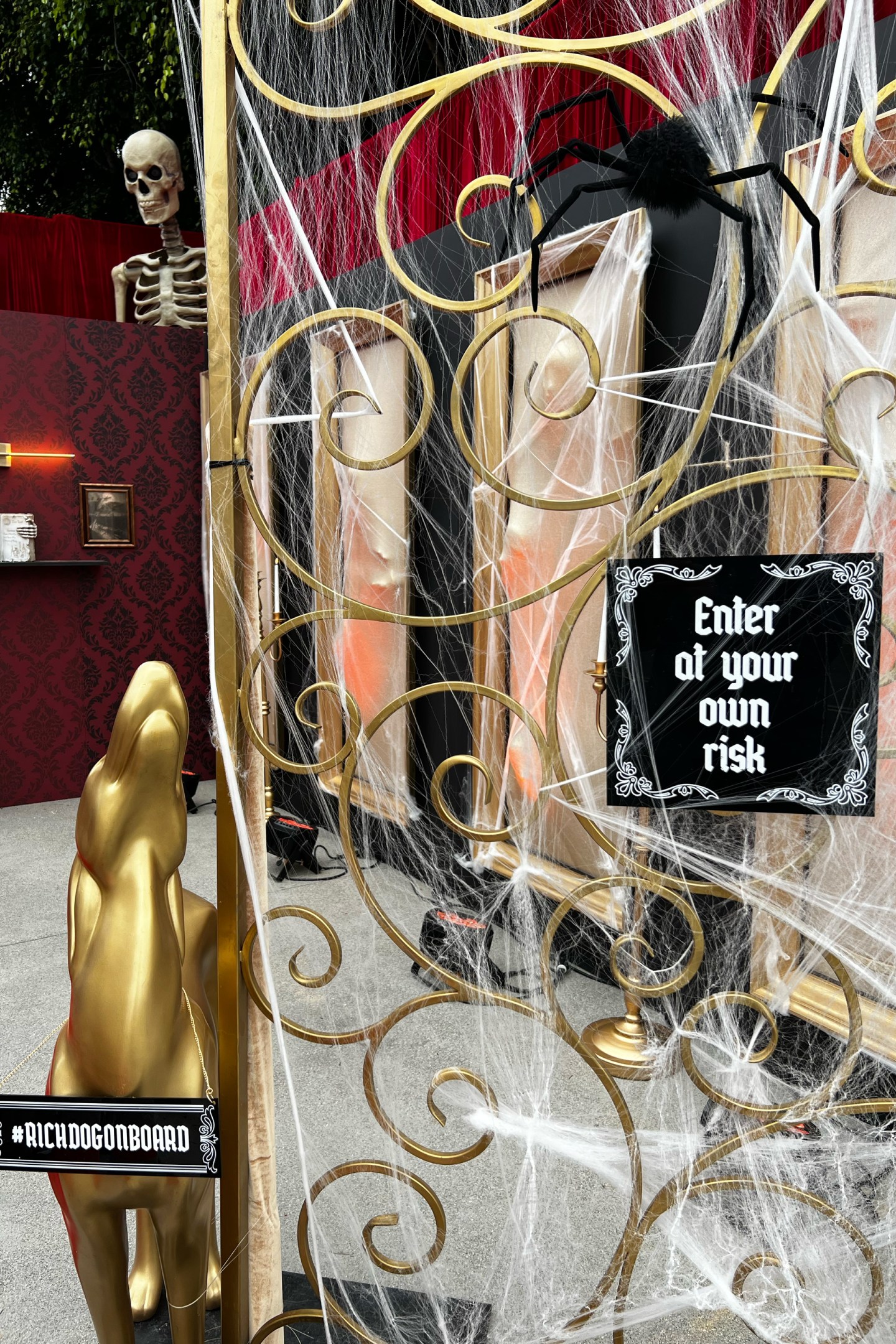 A metal gate with a sign that says “Enter at your own risk”