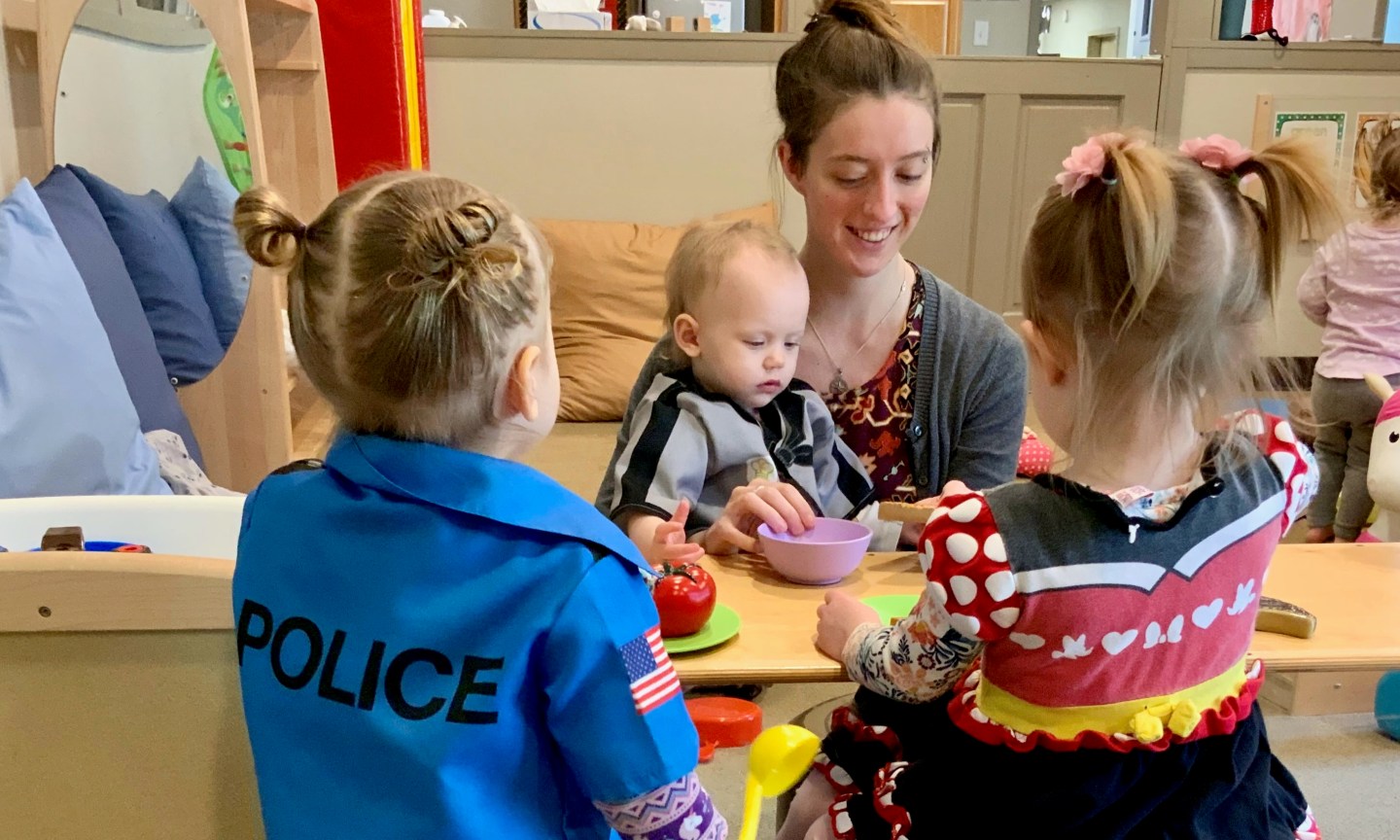 A teacher with two little girls and a baby
