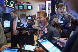 Traders and financial professionals work on the floor of the New York Stock Exchange (NYSE) at the closing bell on October 2, 2019 in New York City.