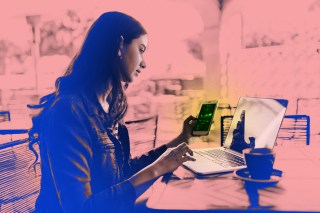 Photo illustration of a young woman sitting at a laptop and holding a cell phone showing investment data.