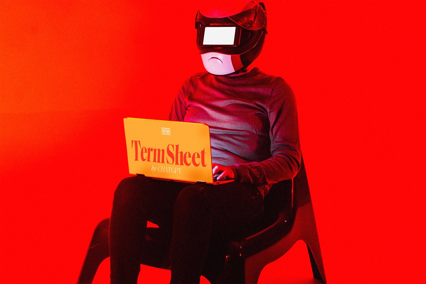 Body with futuristic helmet using laptop on chair over red background writing Term Sheet..