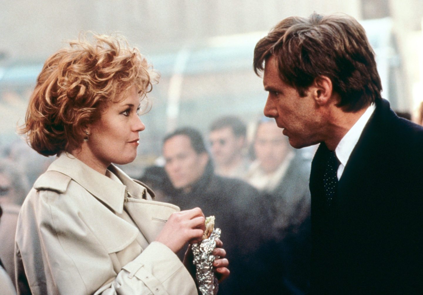 Melanie Griffith and Harrison Ford talking in a scene from the movie Working Girl.