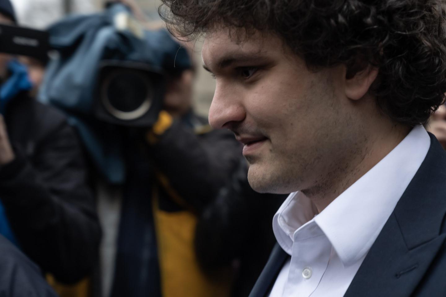Sam Bankman-Fried leaves the court after pleading not guilty to fraud.