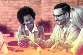 Photo illustration of a financial advisor giving investment advice to a couple of clients.