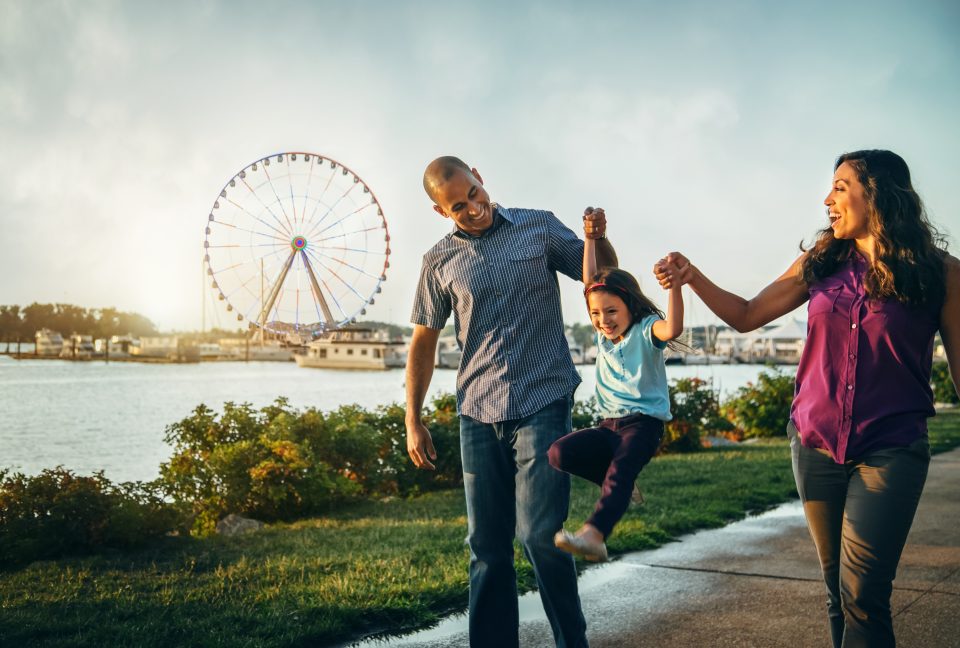 Family takes walk at National Harbor in Maryland.