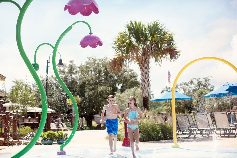 Kids enjoying the splash pad at Grand Hotel.