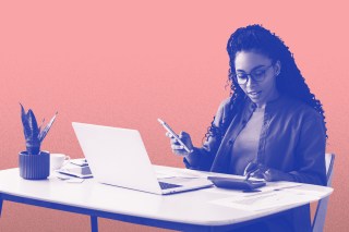 Photo illustration of a woman sitting at a desk and using a mobile phone, calculator, and laptop to review investments.