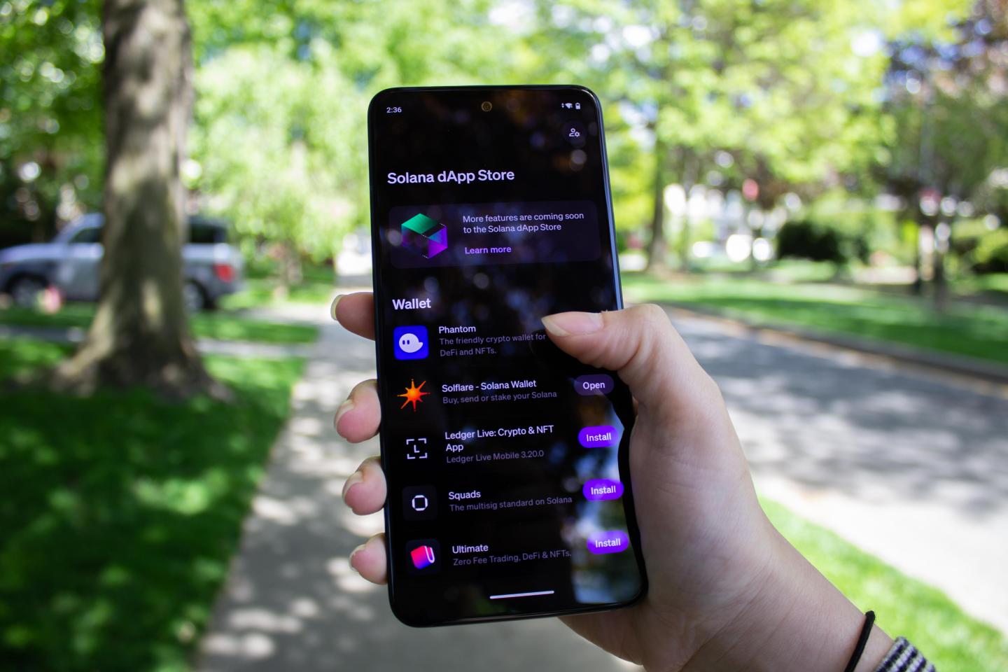Someone holds the Solana Saga as its dApp store is open.