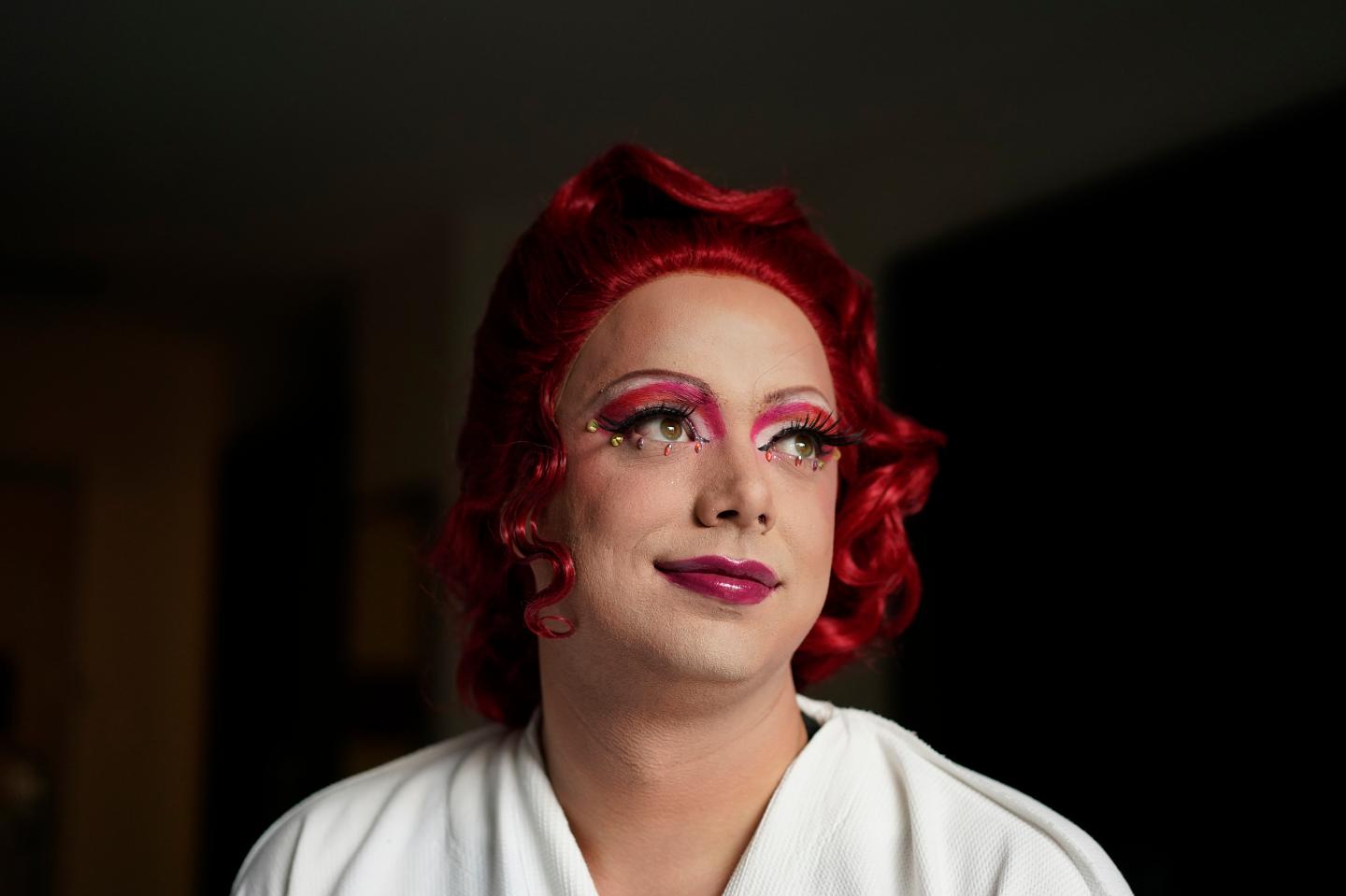 Drag queen Trixy Valentine, aka Jacob Kelley, in a red wig and finished makeup at the Washington Marriott Georgetown, in Washington, Wednesday, May 31, 2023.