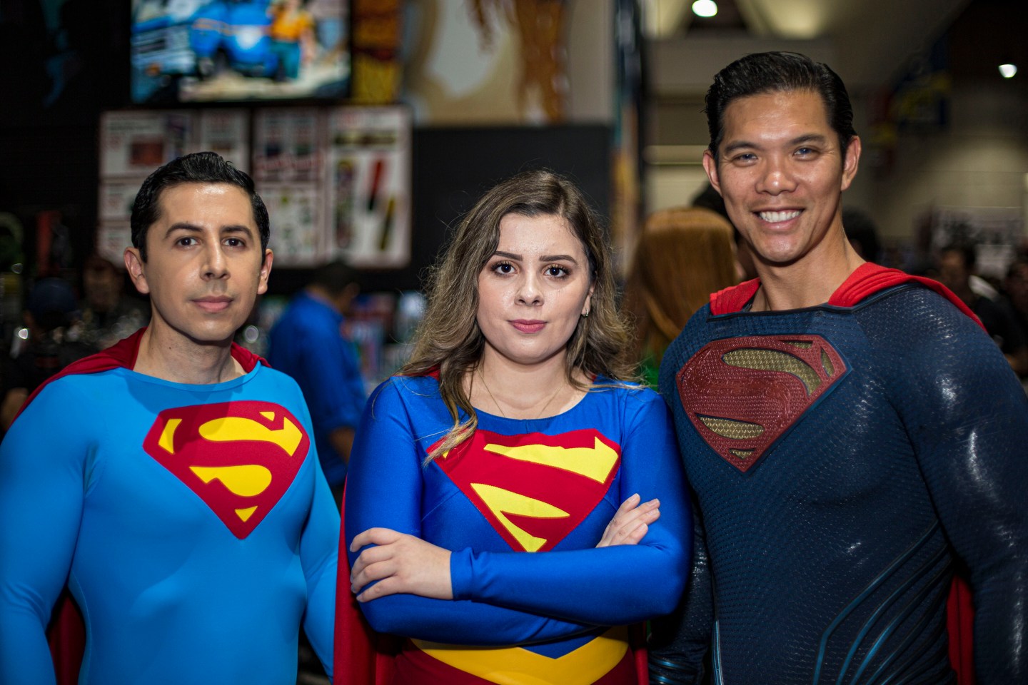 Three people wearing Superman costumes at the 2019 Comic-Con International on July 19, 2019, in San Diego