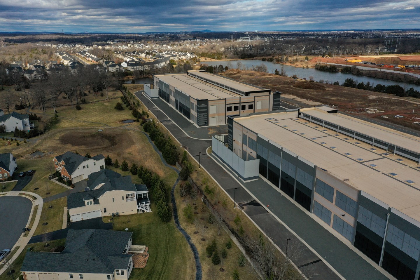 Aerial view of <a href="https://fortune.com/company/amazon-com/" target="_blank">Amazon</a> data centers near homes in northern Virginia