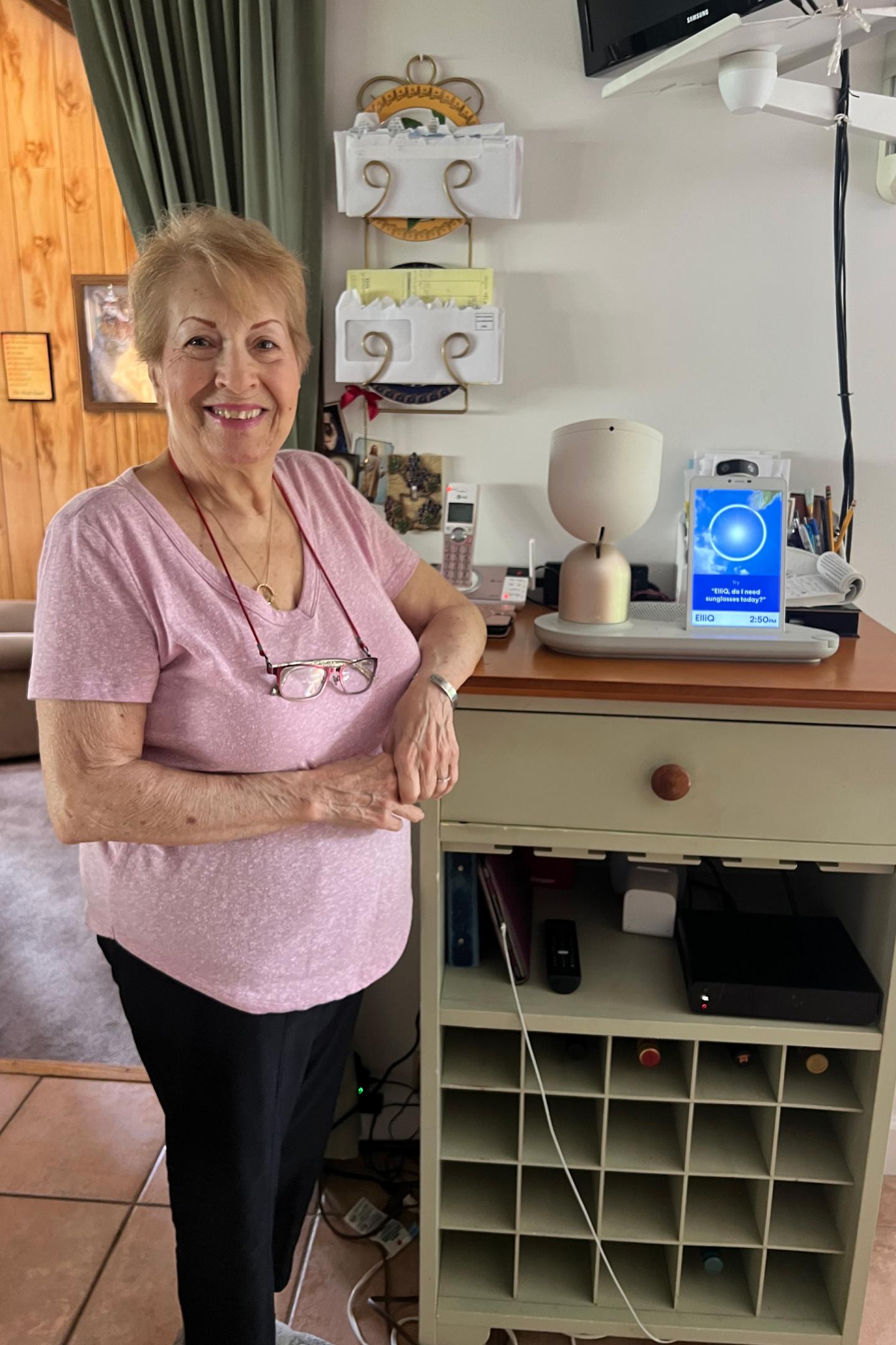 Dottie Elicati at home in Pearl River, N.Y., with her ElliQ housemate.