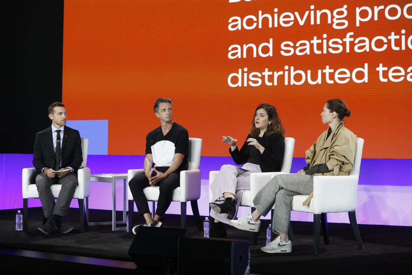 Photo of four people participating in a panel discussion