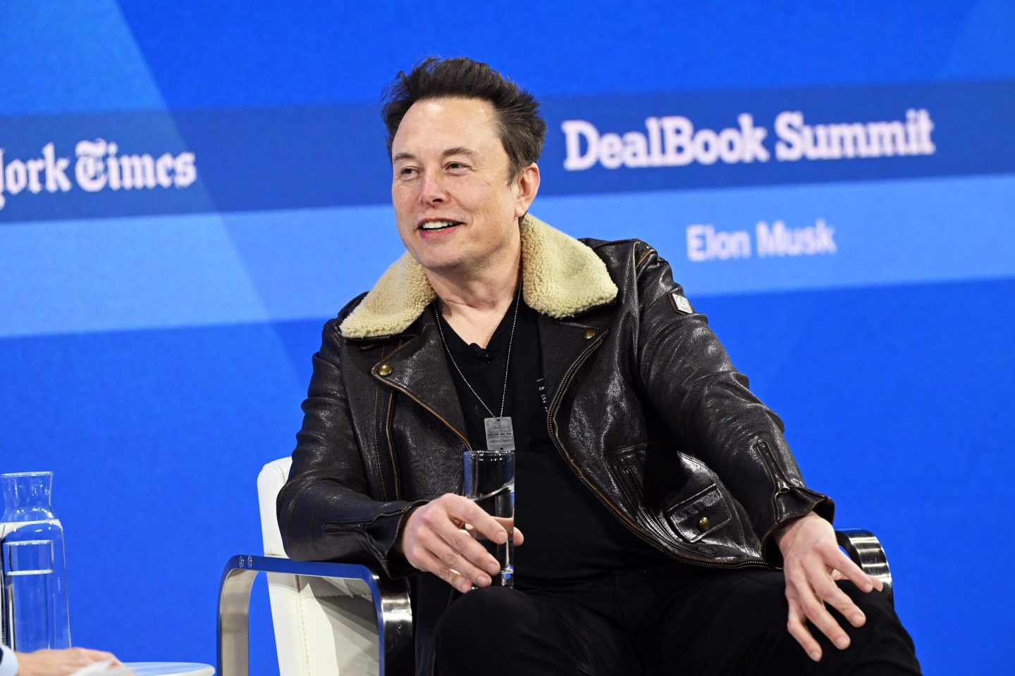 Elon Musk speaks onstage during The New York Times Dealbook Summit 2023