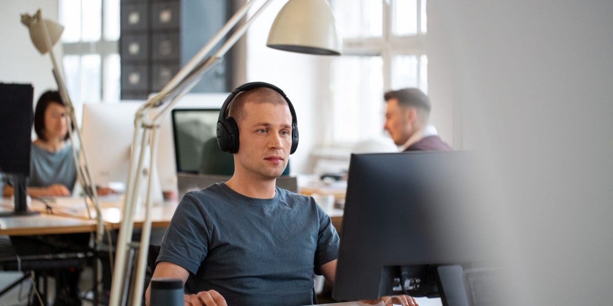 Workers are turning to music as stressful workplaces become the norm. Here&rsquo;s the science of how it works&ndash;and how to find your soundtrack to success