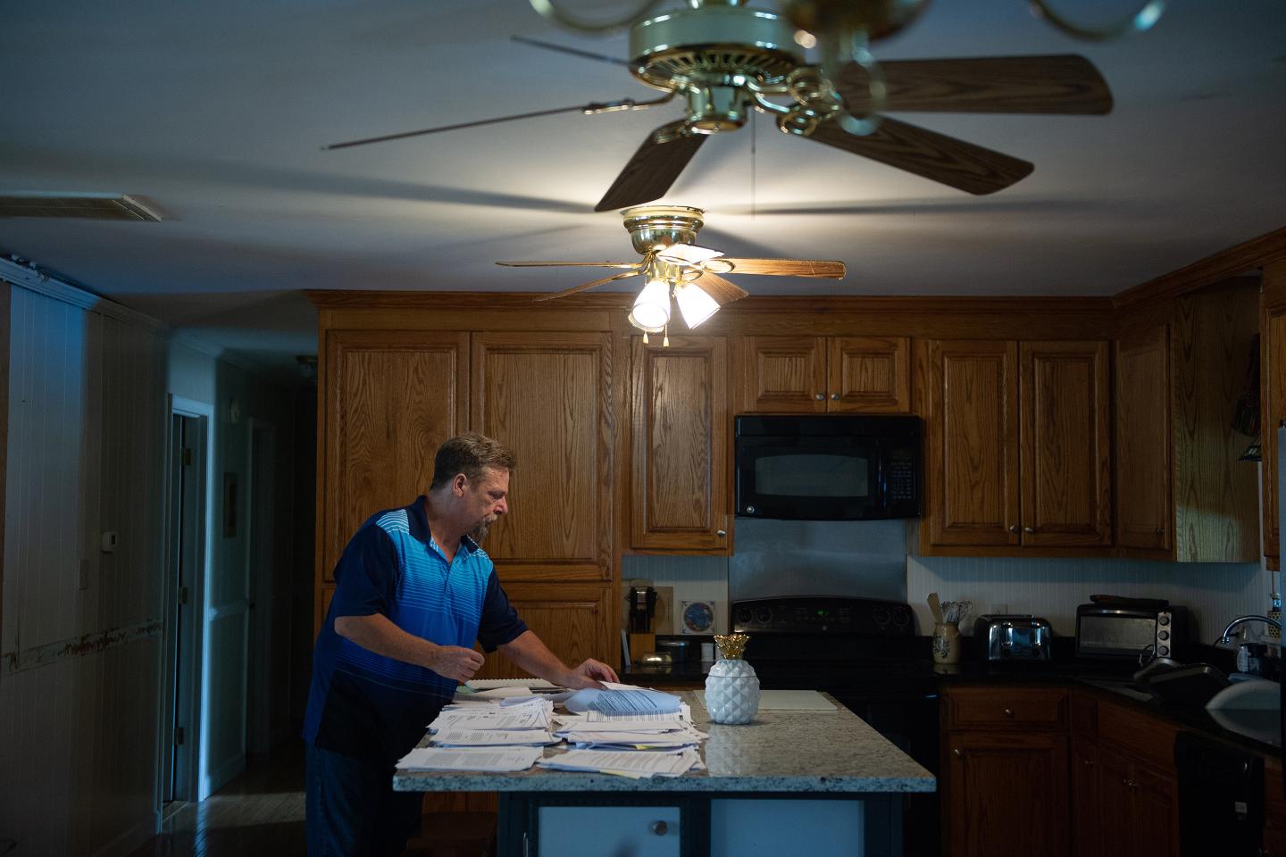 Photo of John Barnett in his kitchen